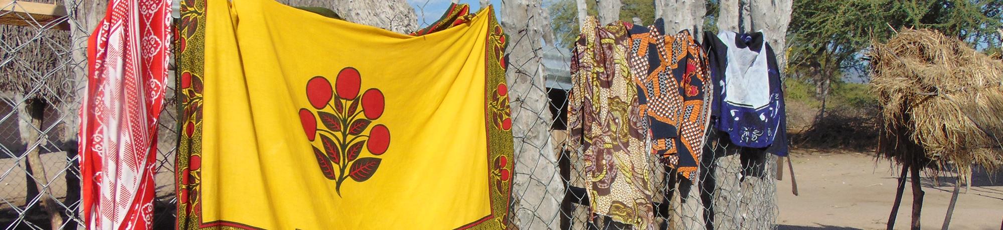 Tanzania textiles hanging on a fence
